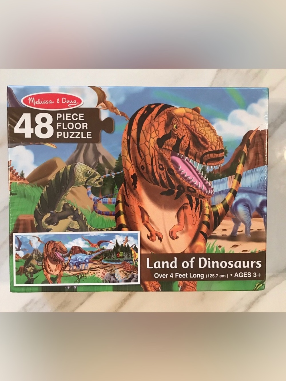 Melissa & Doug "Land of Dinosaurs" 48-piece floor puzzle.